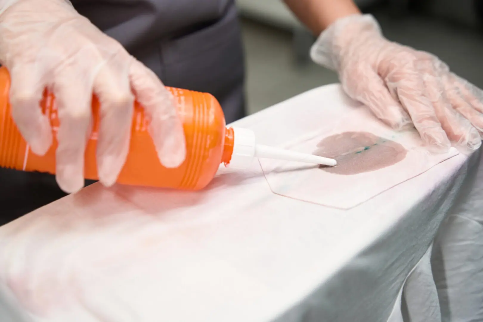 Applying antiseptic to surgical site preparation.