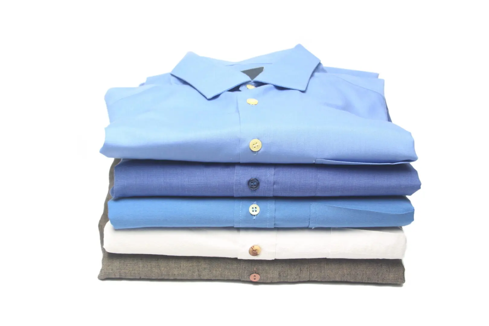 Stack of folded shirts in various colors.